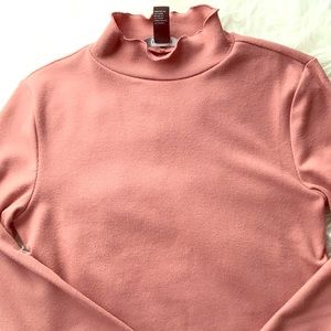 millennial pink ruffled turtleneck
